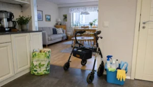 Walking aid, shopping bag, and cleaning basket in a home show everyday support around alvittomat siivouspalvelut.